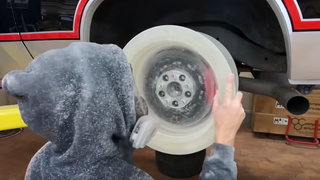 Watch This Guy's Homemade Epoxy Wheel Survive An Incredible Driveway Burnout